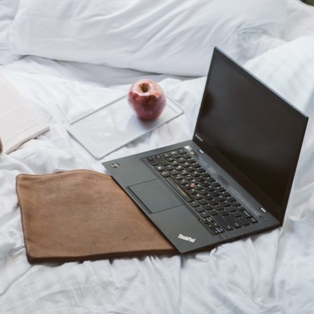 laptop-on-bed-near-the-balcony-4099388